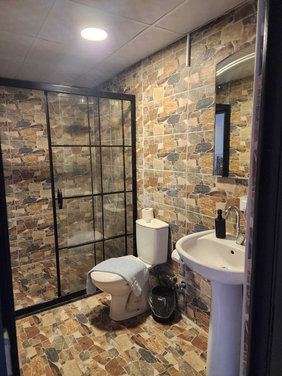 Quadruple Room, Garden View | Bathroom | Shower, hair dryer, slippers, towels