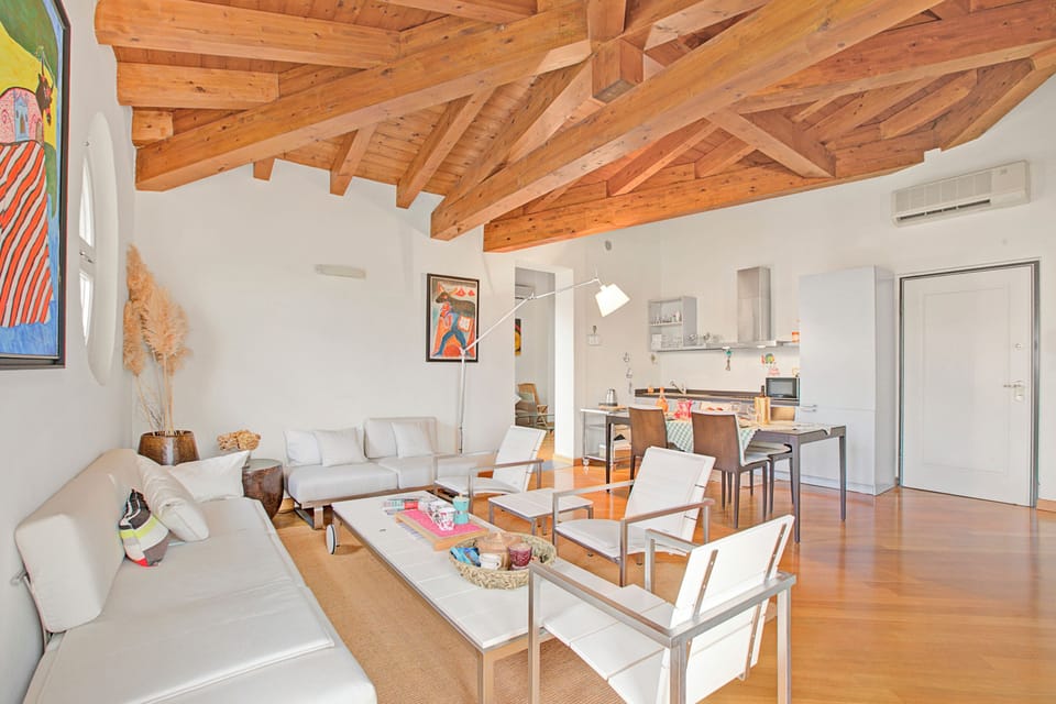 Family Apartment, 2 Bedrooms, 2 Bathrooms, Lakeside (Morgante Salò-Lake view & parking) | Living area | Flat-screen TV