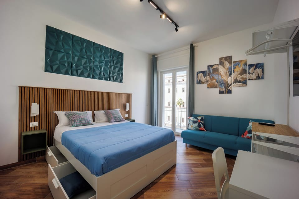 Deluxe Triple Room, Balcony, City View | Soundproofing, iron/ironing board (on request), WiFi (free)