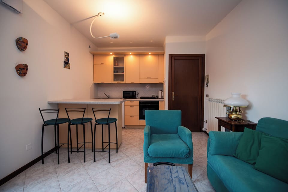Basic Apartment, Patio, Garden View | Living area | 20-inch flat-screen TV with digital channels