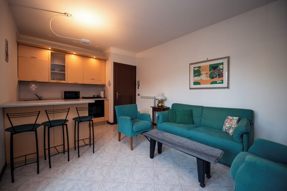 Basic Apartment, Patio, Garden View | Living area | 20-inch flat-screen TV with digital channels