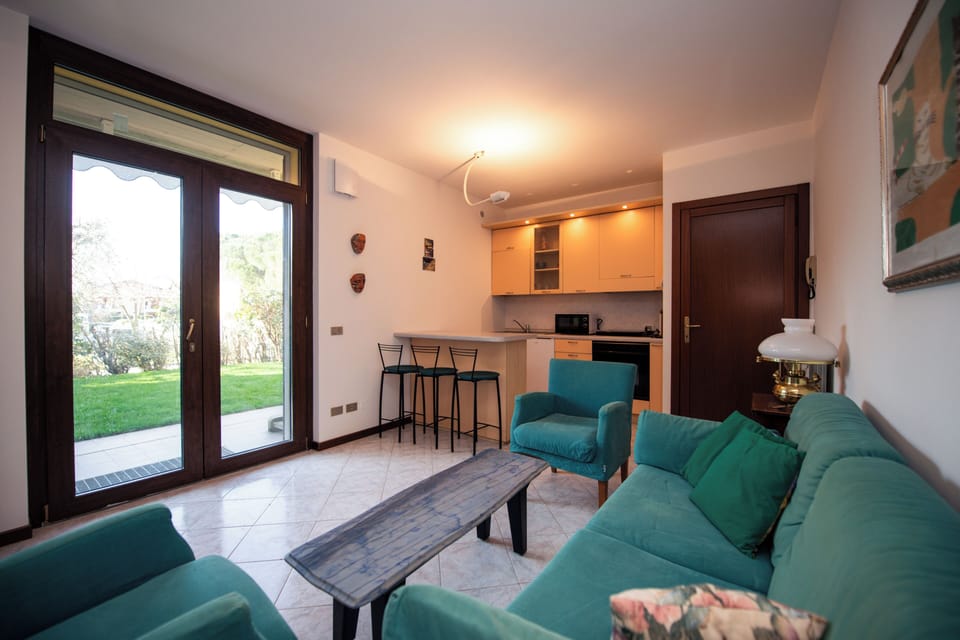 Basic Apartment, Patio, Garden View | Living area | 20-inch flat-screen TV with digital channels