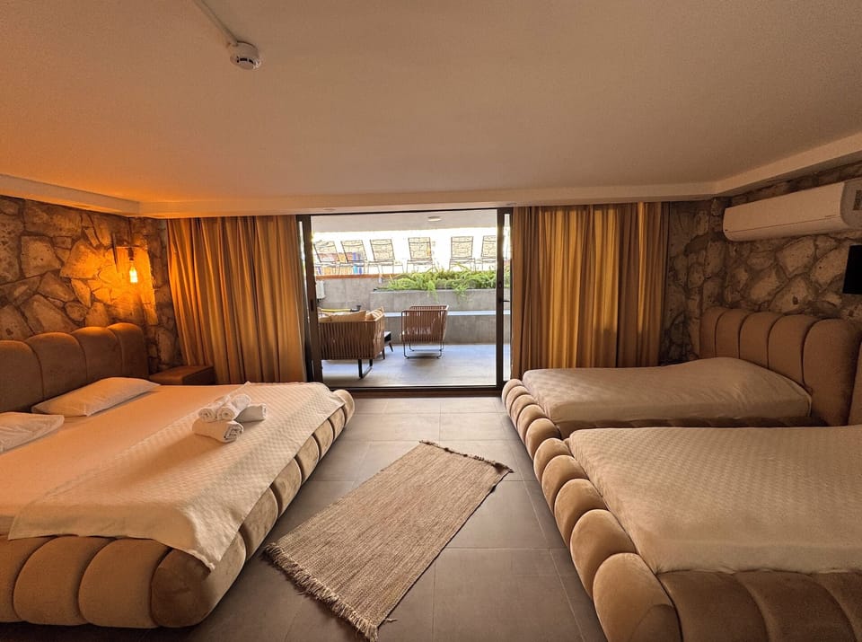 Family Quadruple Room, Lanai | In-room safe, bed sheets
