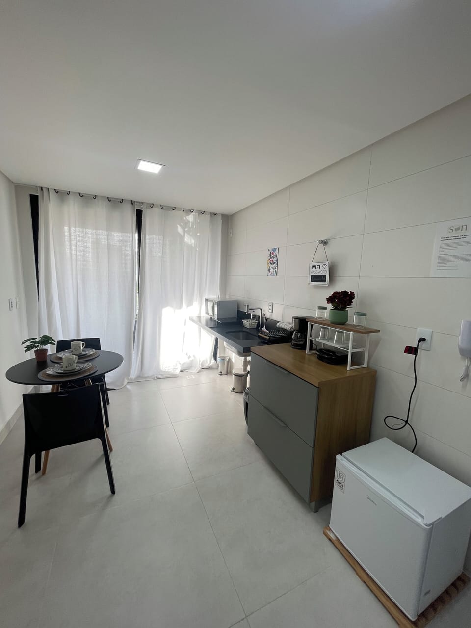 Apartment | Private kitchen | Mini-fridge, microwave, stovetop, cookware/dishes/utensils