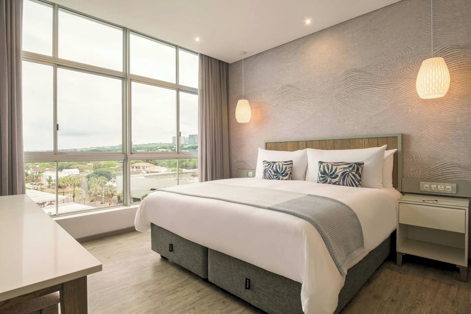 Suite, 1 Bedroom, Partial Ocean View | 1 bedroom, in-room safe, desk, laptop workspace