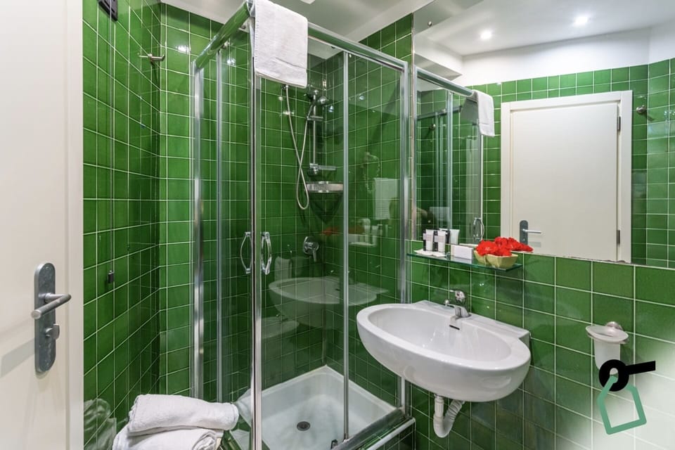 Triple Room, Balcony | Bathroom | Shower, free toiletries, hair dryer, towels