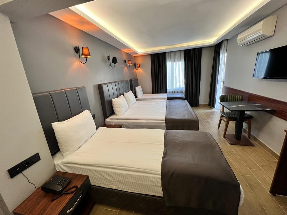 Family Quadruple Room | Minibar, laptop workspace, free WiFi
