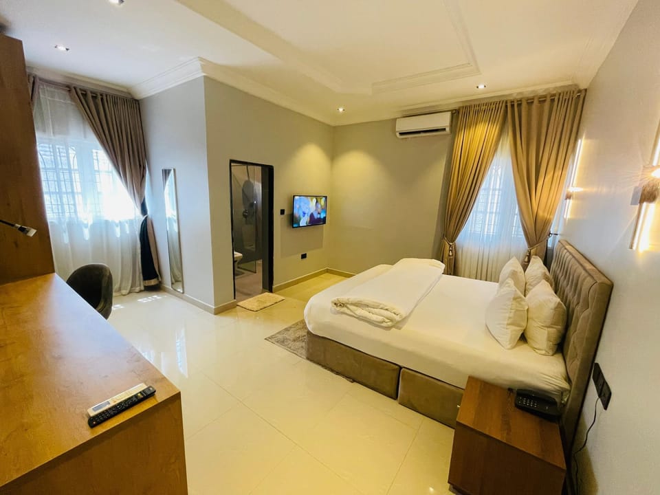 Luxury Apartment, 3 Bedrooms, Balcony, Garden View | 3 bedrooms, desk, laptop workspace, iron/ironing board