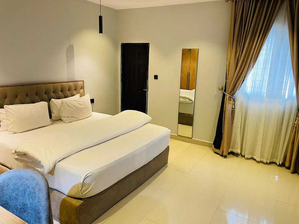 Luxury Apartment, 3 Bedrooms, Balcony, Garden View | 3 bedrooms, desk, laptop workspace, iron/ironing board