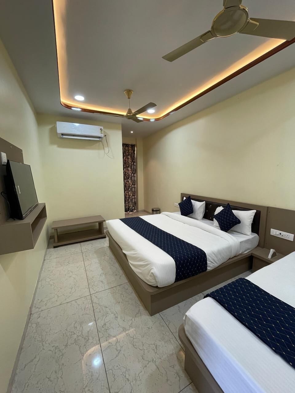Deluxe Triple Room, Private Bathroom | In-room safe, desk, blackout drapes, iron/ironing board (on request)