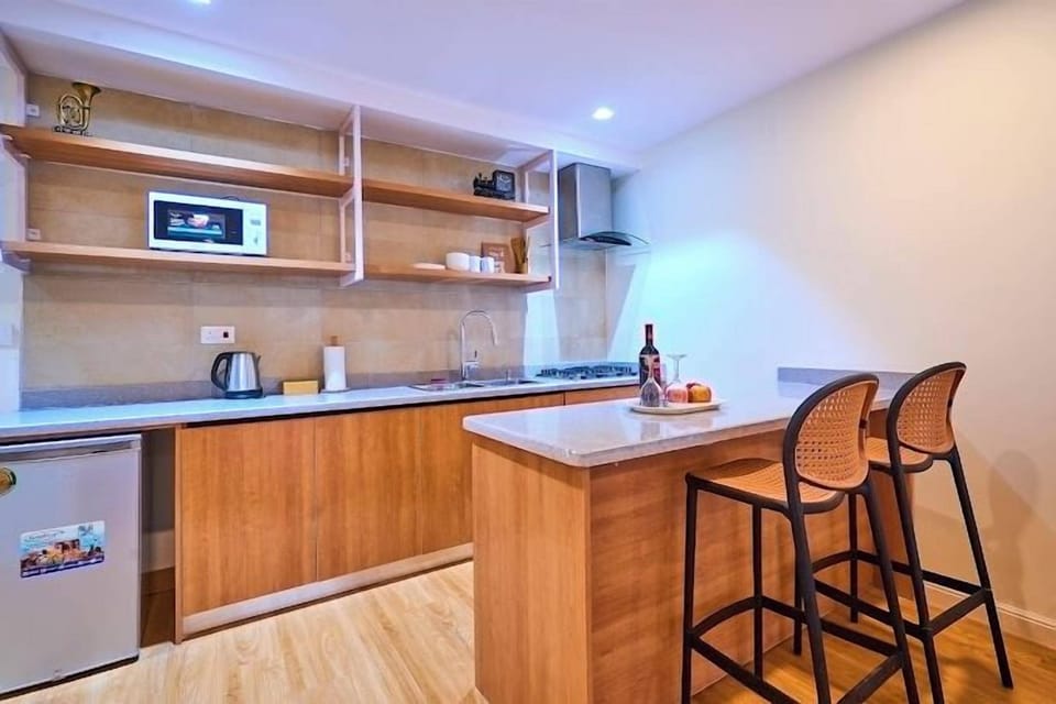 Economy Apartment, Balcony, City View | Private kitchen | Fridge, microwave, oven, stovetop