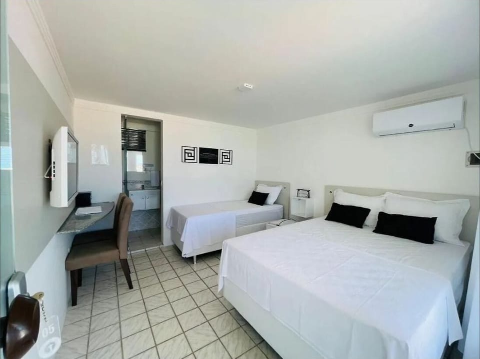Comfort Triple Room, Private Bathroom, Beachfront | Laptop workspace, blackout drapes, iron/ironing board, free WiFi