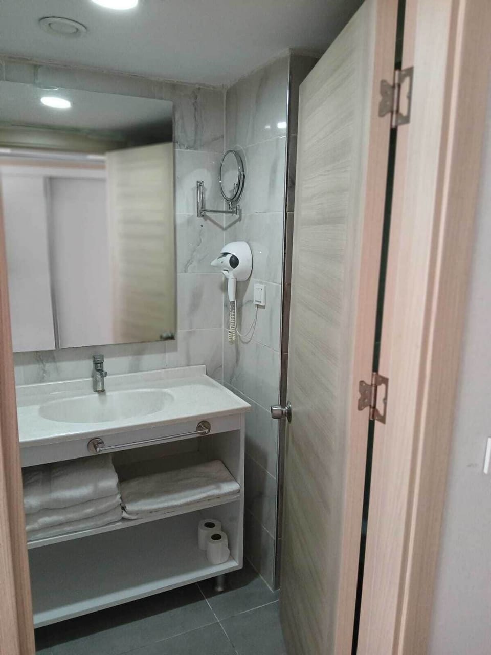 Shower, hair dryer, slippers, towels