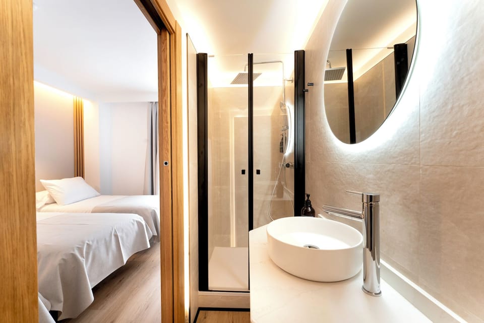 Deluxe Triple Room, City View | Bathroom | Shower, hair dryer, towels, soap