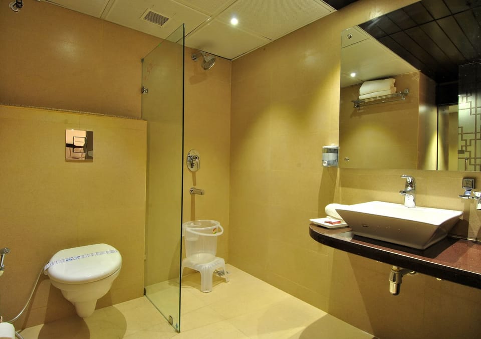 Shower, hair dryer, slippers, towels