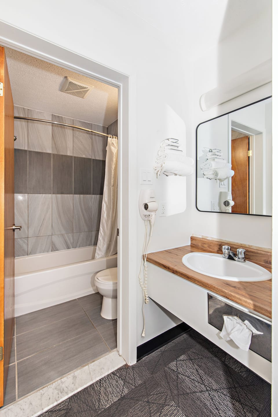 Combined shower/tub, hair dryer, towels, soap