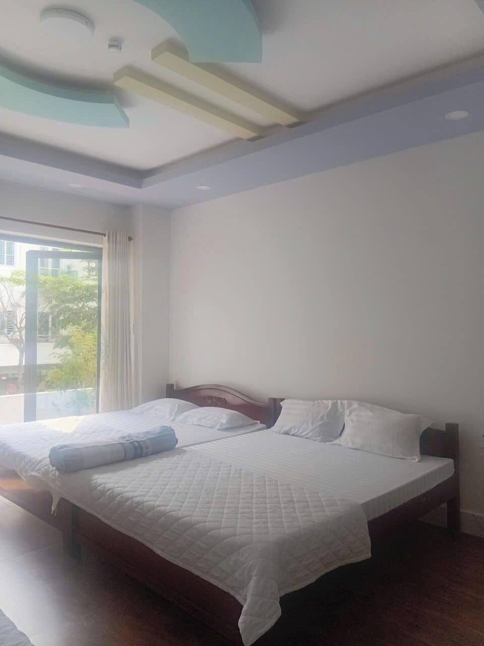 Deluxe Quadruple Room (2nd Floor) | Desk, laptop workspace, blackout drapes, soundproofing