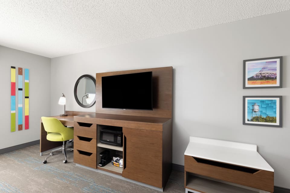 Premium bedding, desk, laptop workspace, blackout drapes