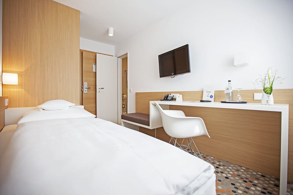 Premium bedding, down comforters, in-room safe, desk