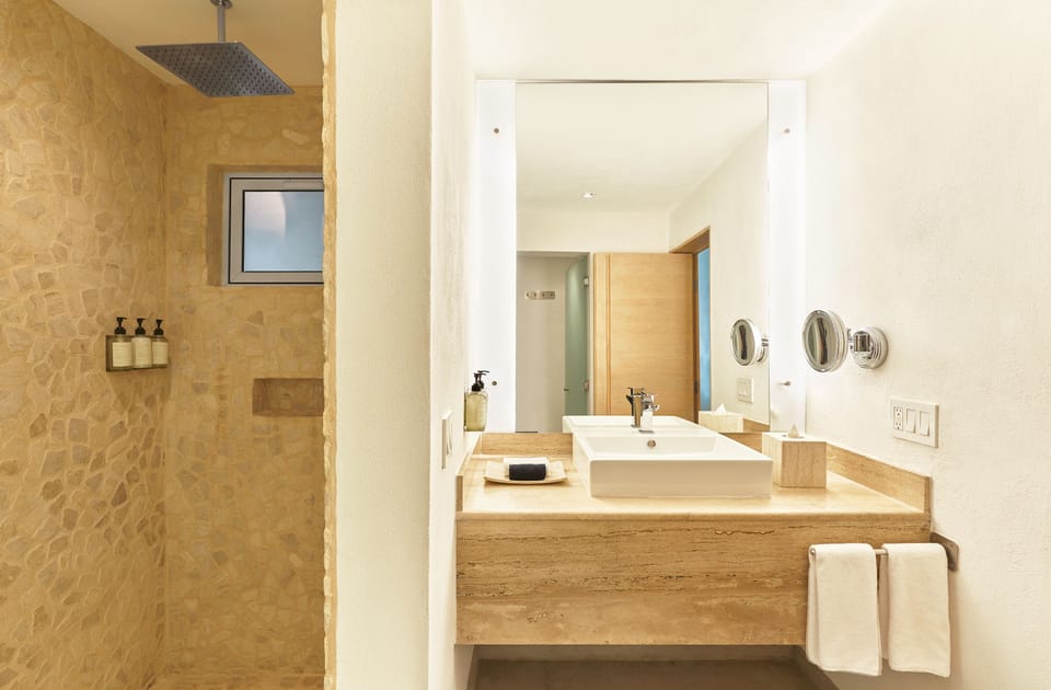 Exclusive Suite, Jetted Tub, Poolside | Bathroom | Shower, rainfall showerhead, designer toiletries, hair dryer