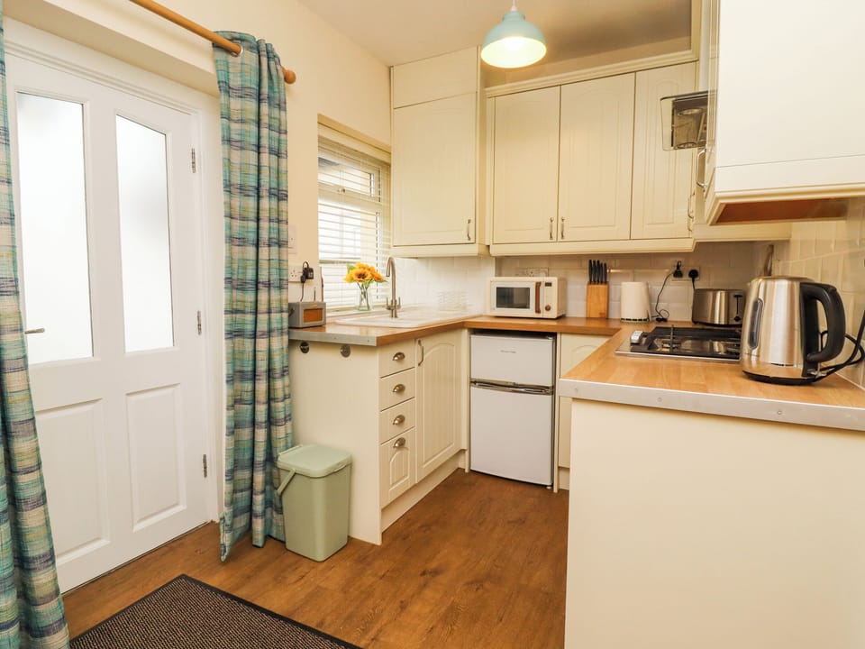 Fridge, electric kettle, toaster, cookware/dishes/utensils