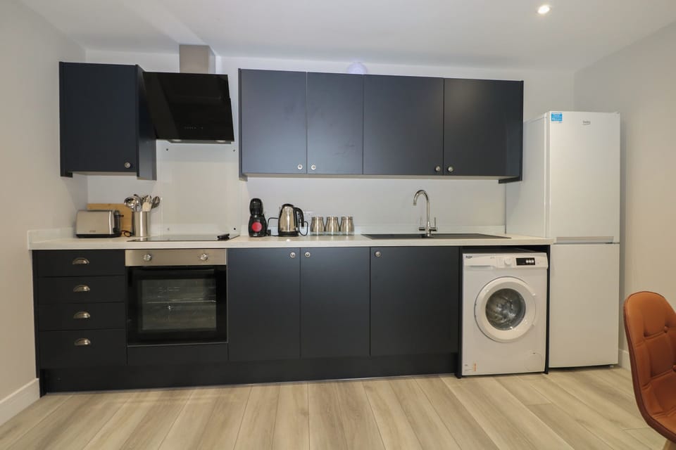 Fridge, electric kettle, cookware/dishes/utensils