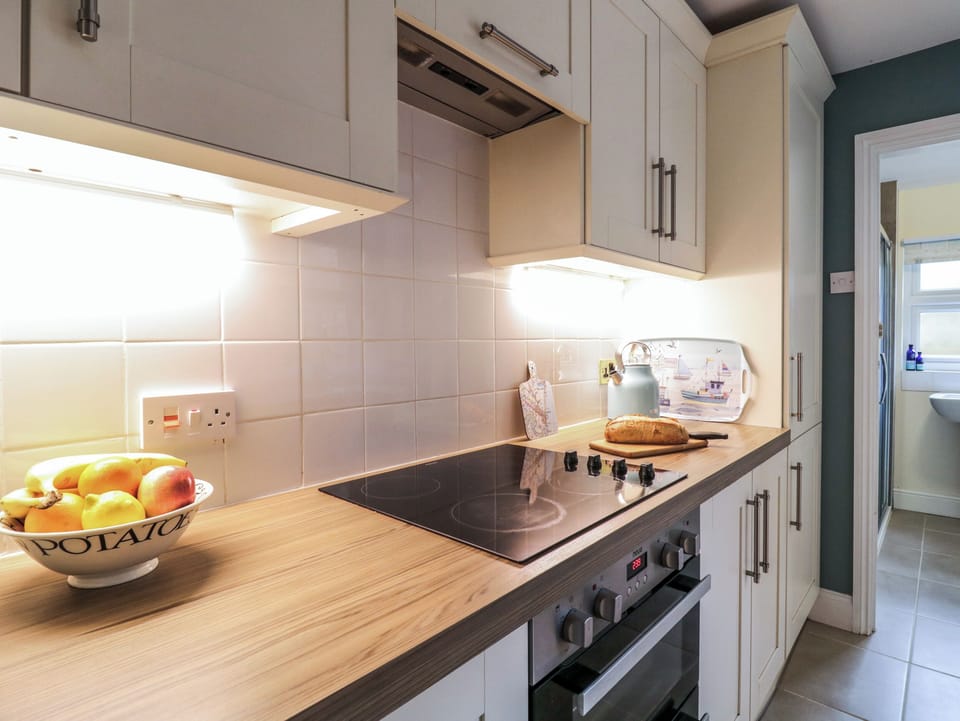 Fridge, electric kettle, toaster, cookware/dishes/utensils