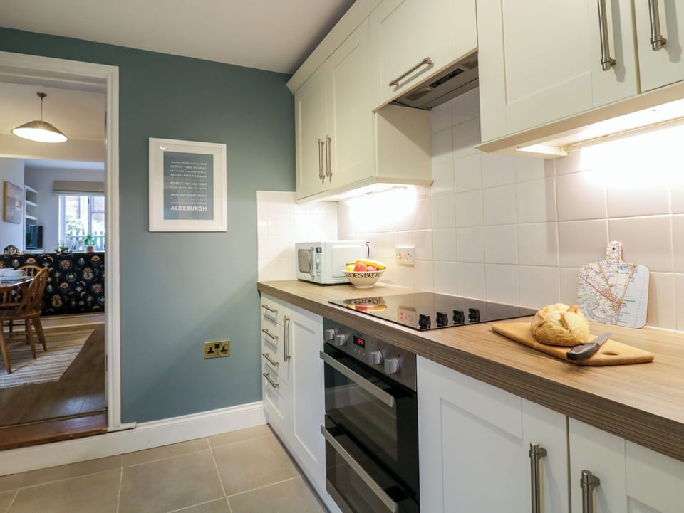 Fridge, electric kettle, toaster, cookware/dishes/utensils