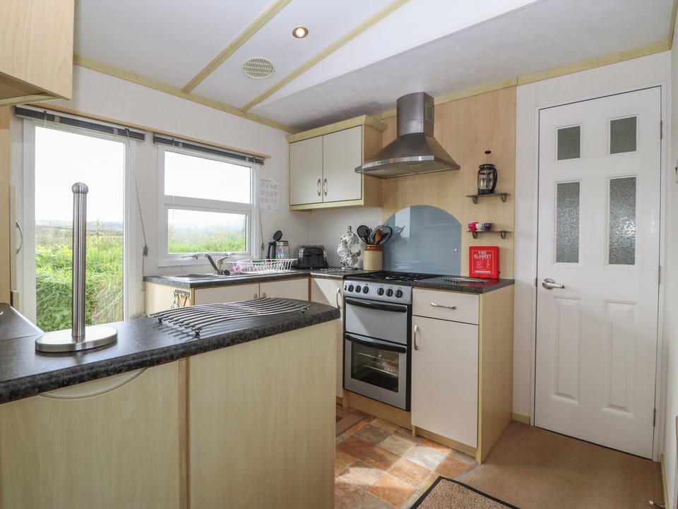 Fridge, electric kettle, toaster, cookware/dishes/utensils