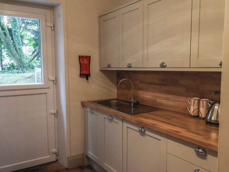 Fridge, electric kettle, toaster, cookware/dishes/utensils