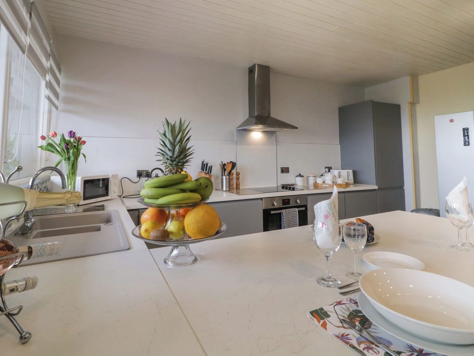 Fridge, electric kettle, cookware/dishes/utensils