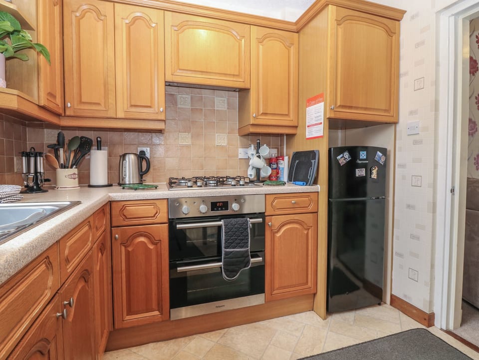 Fridge, electric kettle, toaster, cookware/dishes/utensils