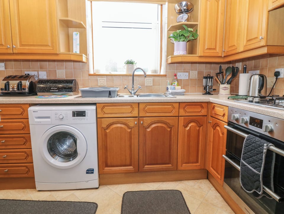 Fridge, electric kettle, toaster, cookware/dishes/utensils