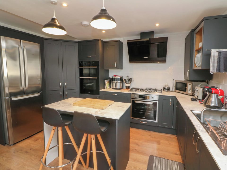Fridge, electric kettle, toaster, cookware/dishes/utensils