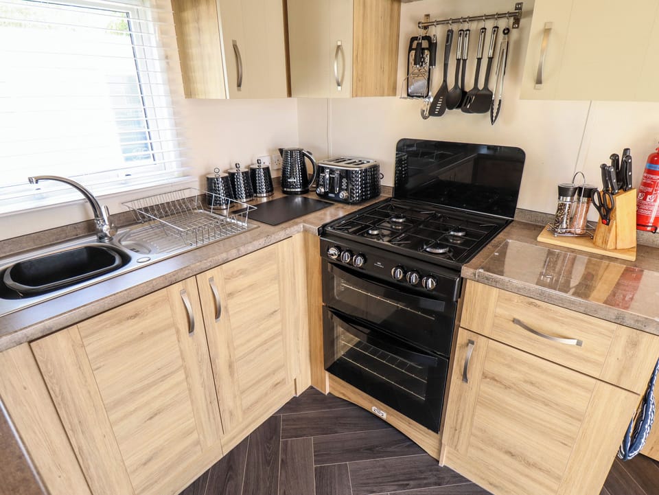 Fridge, electric kettle, toaster, cookware/dishes/utensils