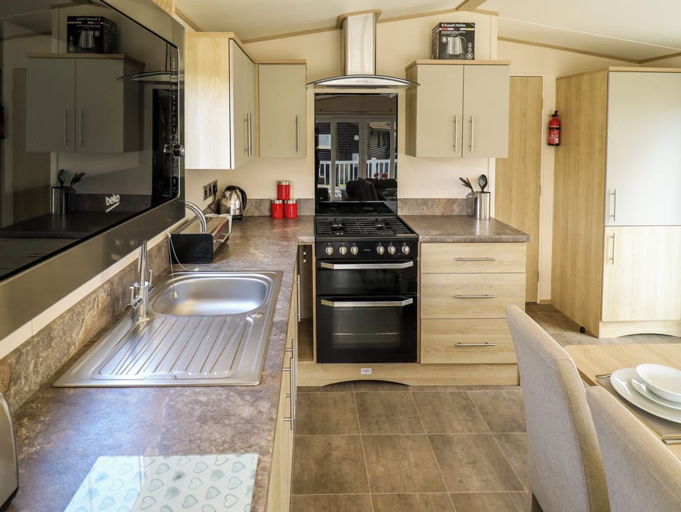 Fridge, electric kettle, toaster, cookware/dishes/utensils