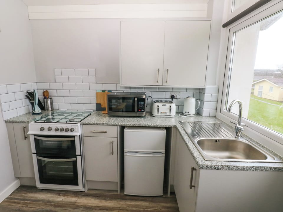 Fridge, electric kettle, toaster, cookware/dishes/utensils