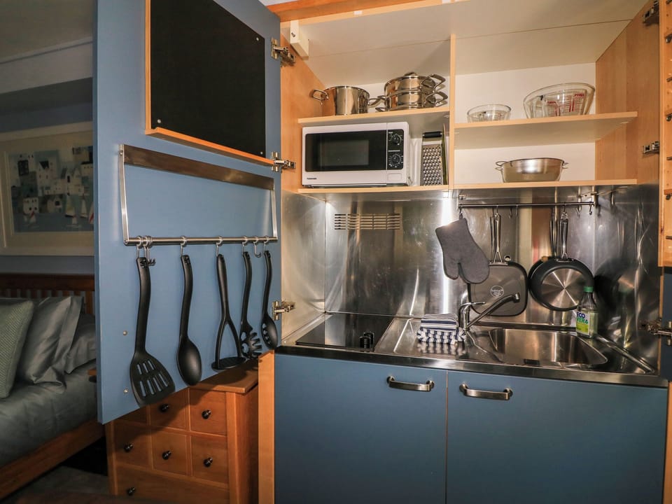 Fridge, electric kettle, toaster, cookware/dishes/utensils
