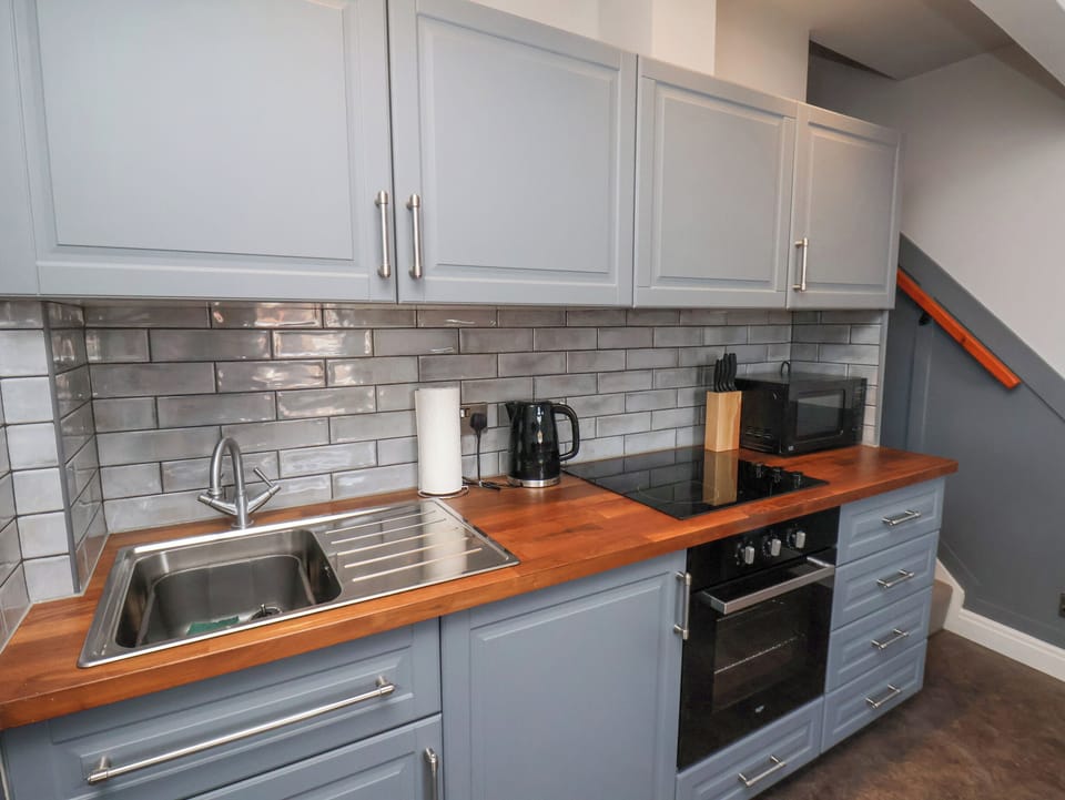 Fridge, electric kettle, toaster, cookware/dishes/utensils