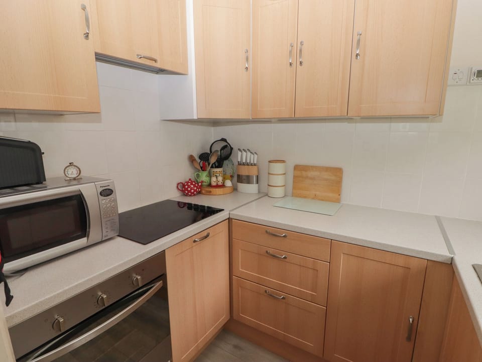 Fridge, electric kettle, toaster, cookware/dishes/utensils