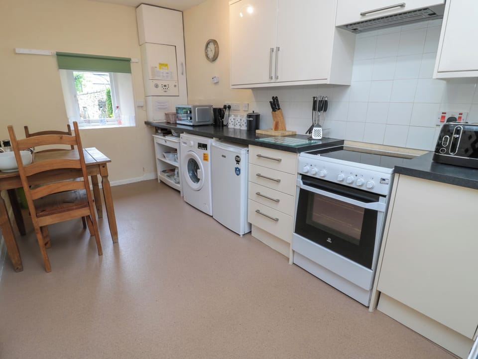 Fridge, electric kettle, toaster, cookware/dishes/utensils