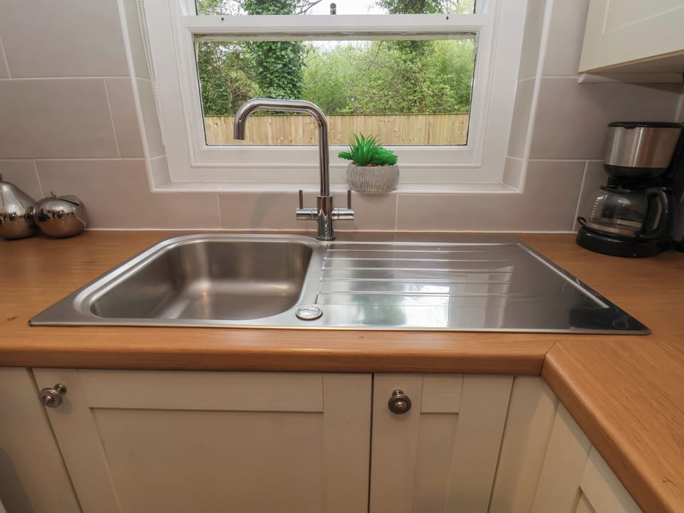 Fridge, electric kettle, toaster, cookware/dishes/utensils