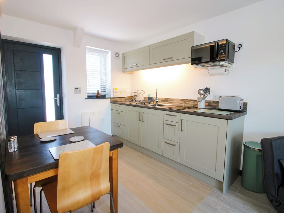 Fridge, electric kettle, toaster, cookware/dishes/utensils