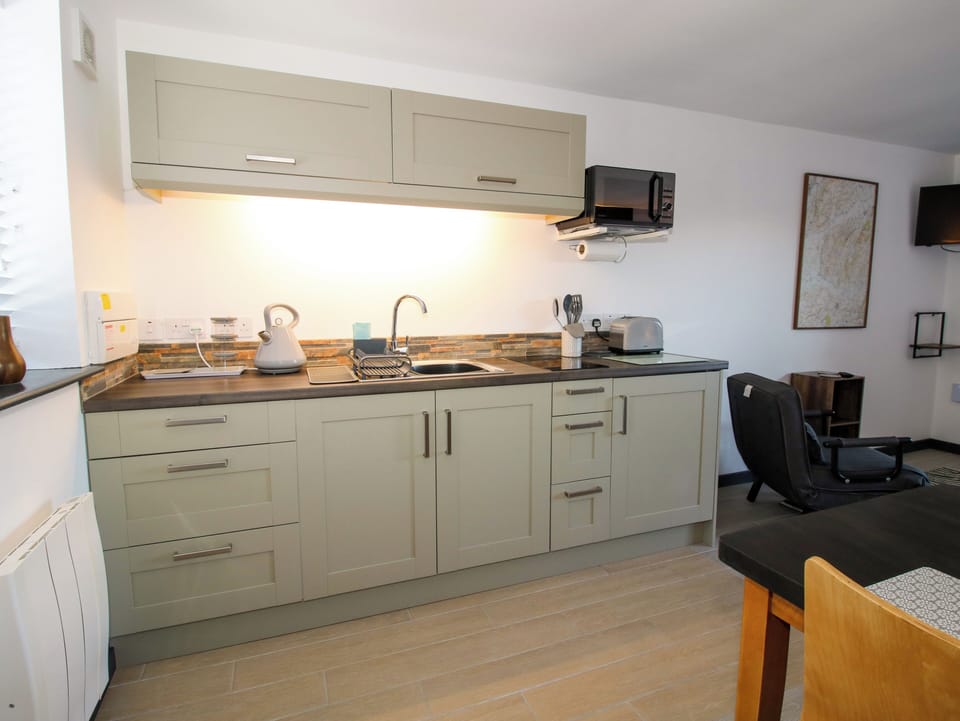 Fridge, electric kettle, toaster, cookware/dishes/utensils
