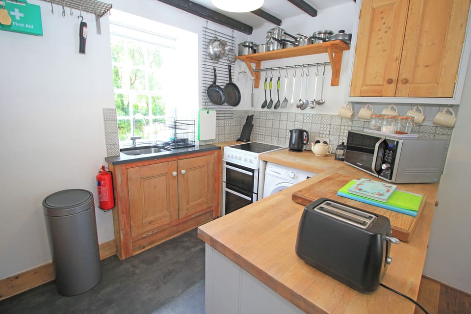 Fridge, electric kettle, toaster, cookware/dishes/utensils