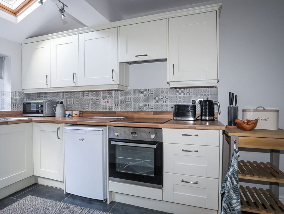 Fridge, electric kettle, toaster, cookware/dishes/utensils