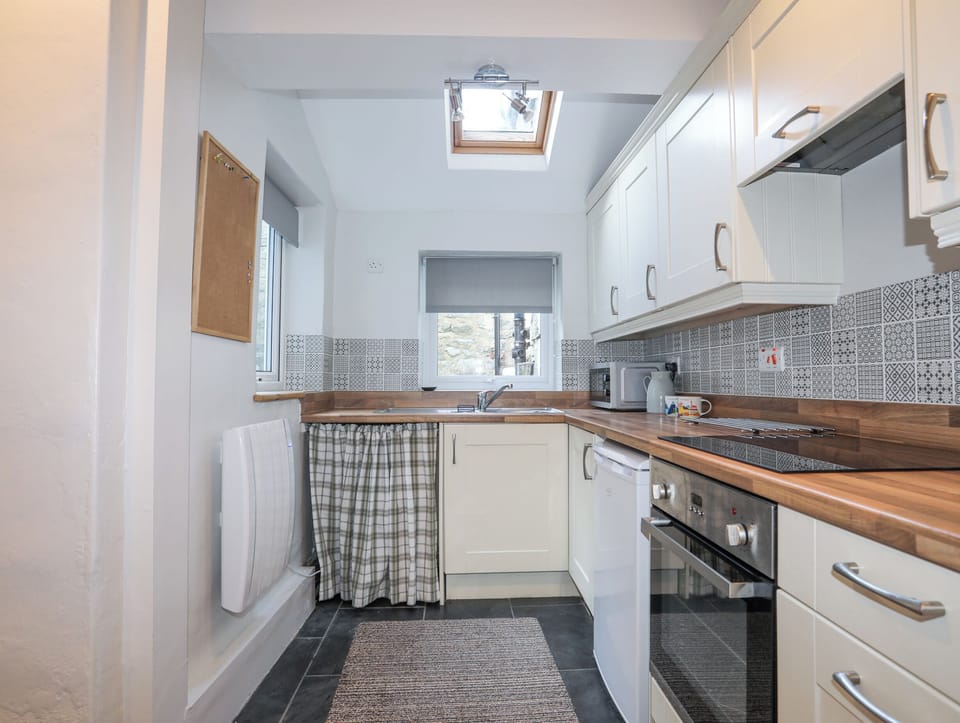 Fridge, electric kettle, toaster, cookware/dishes/utensils