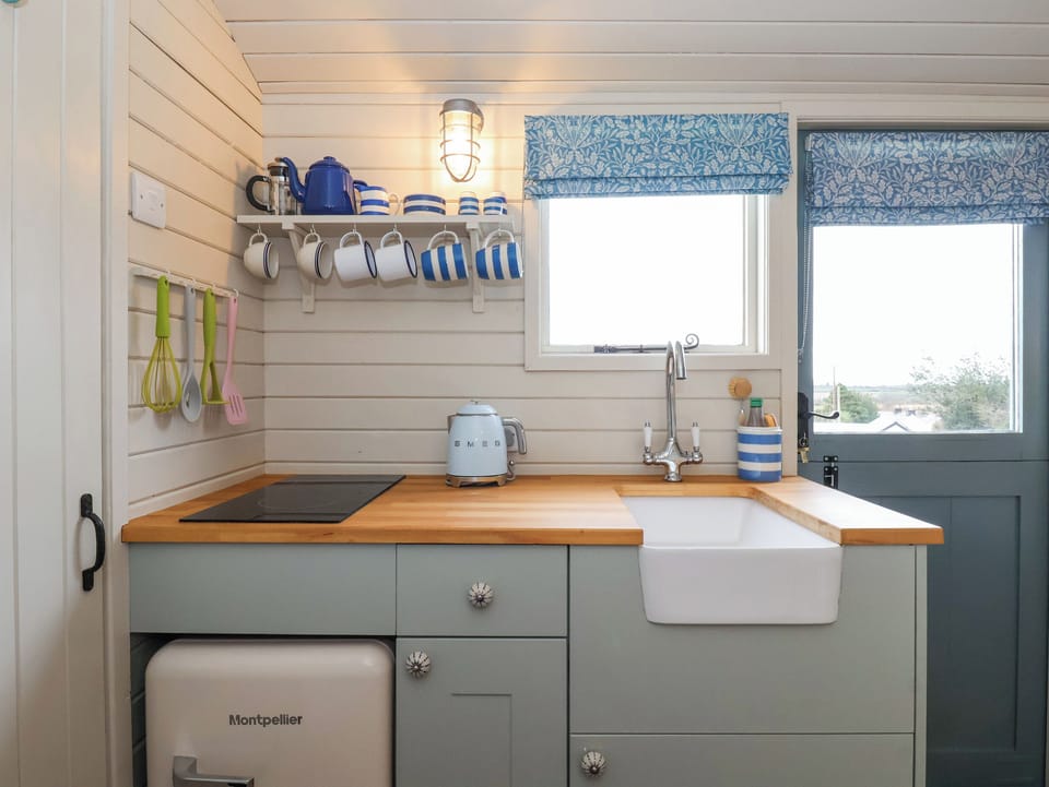 Fridge, electric kettle, cookware/dishes/utensils