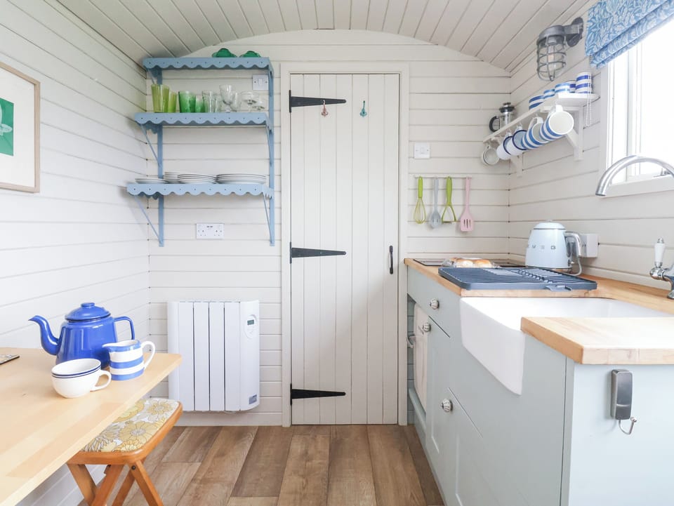 Fridge, electric kettle, cookware/dishes/utensils