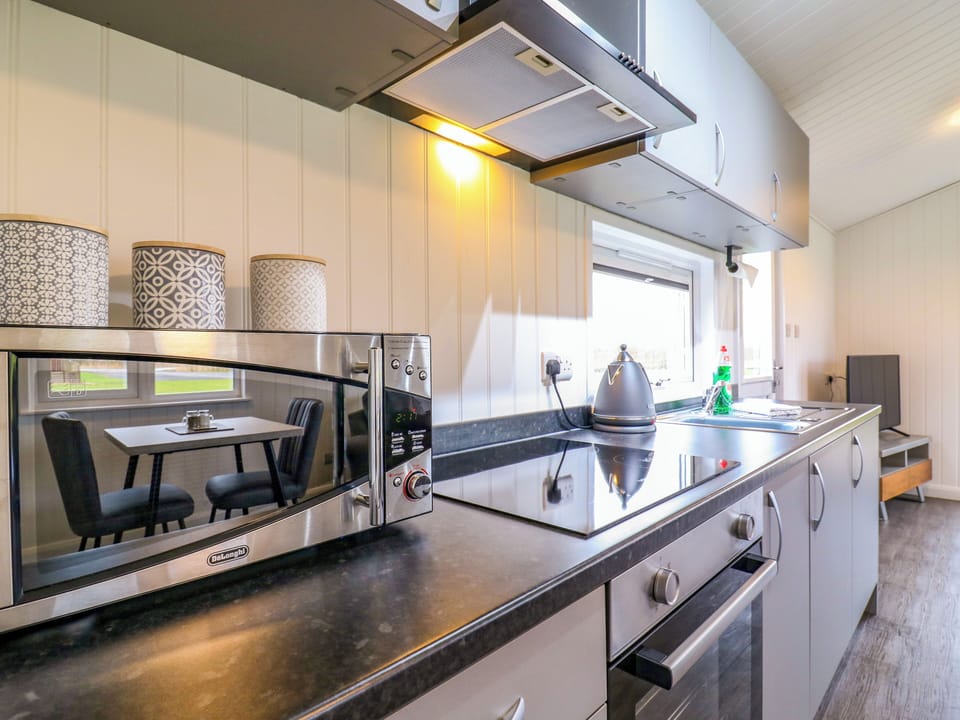 Fridge, electric kettle, cookware/dishes/utensils